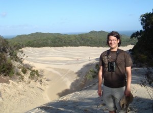 Enjoying a the sand dunes of Fraser Island after a climb.